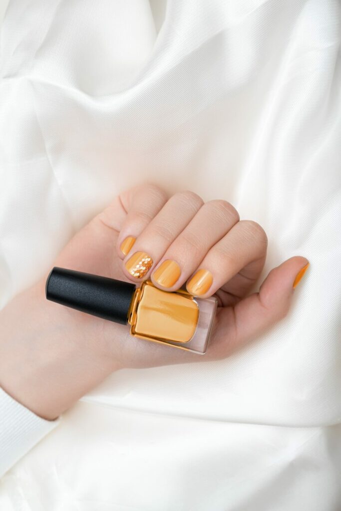 yellow nail manicure